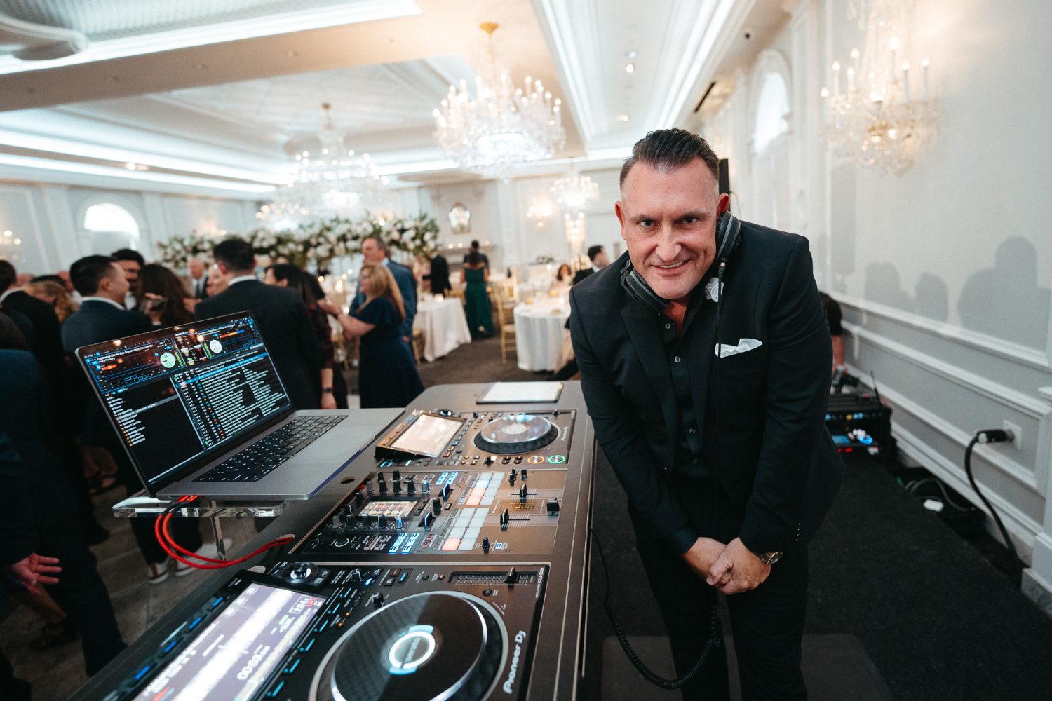 Jason Jani at the booth in a bright ballroom