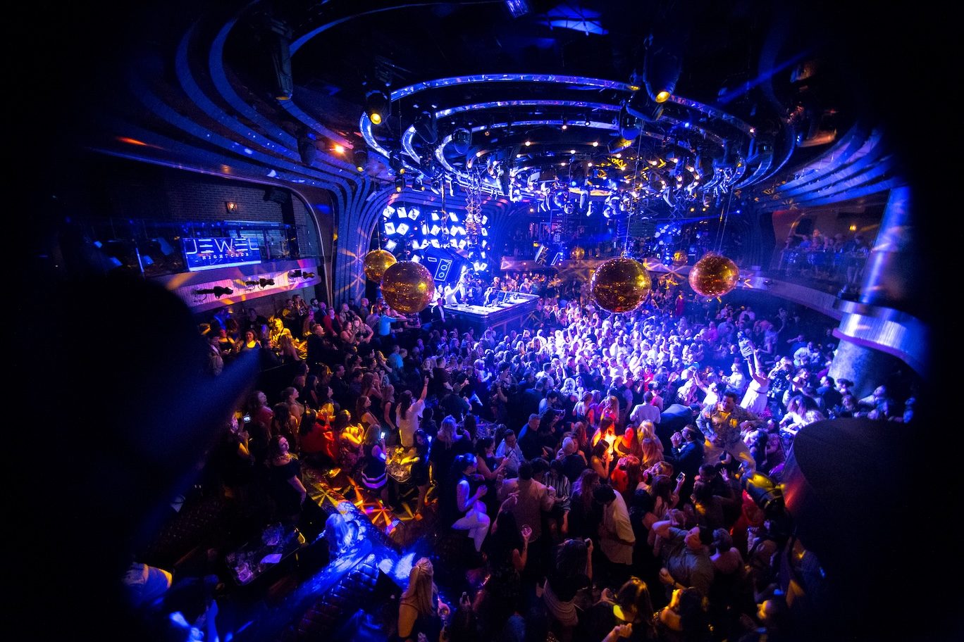 Packed floor at Jewel Nightclub under blue light