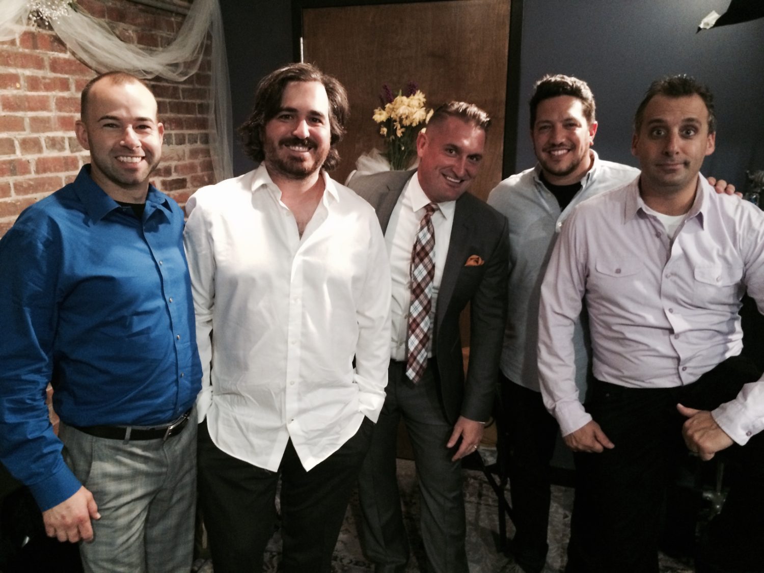 Jason Jani with four men on a television set