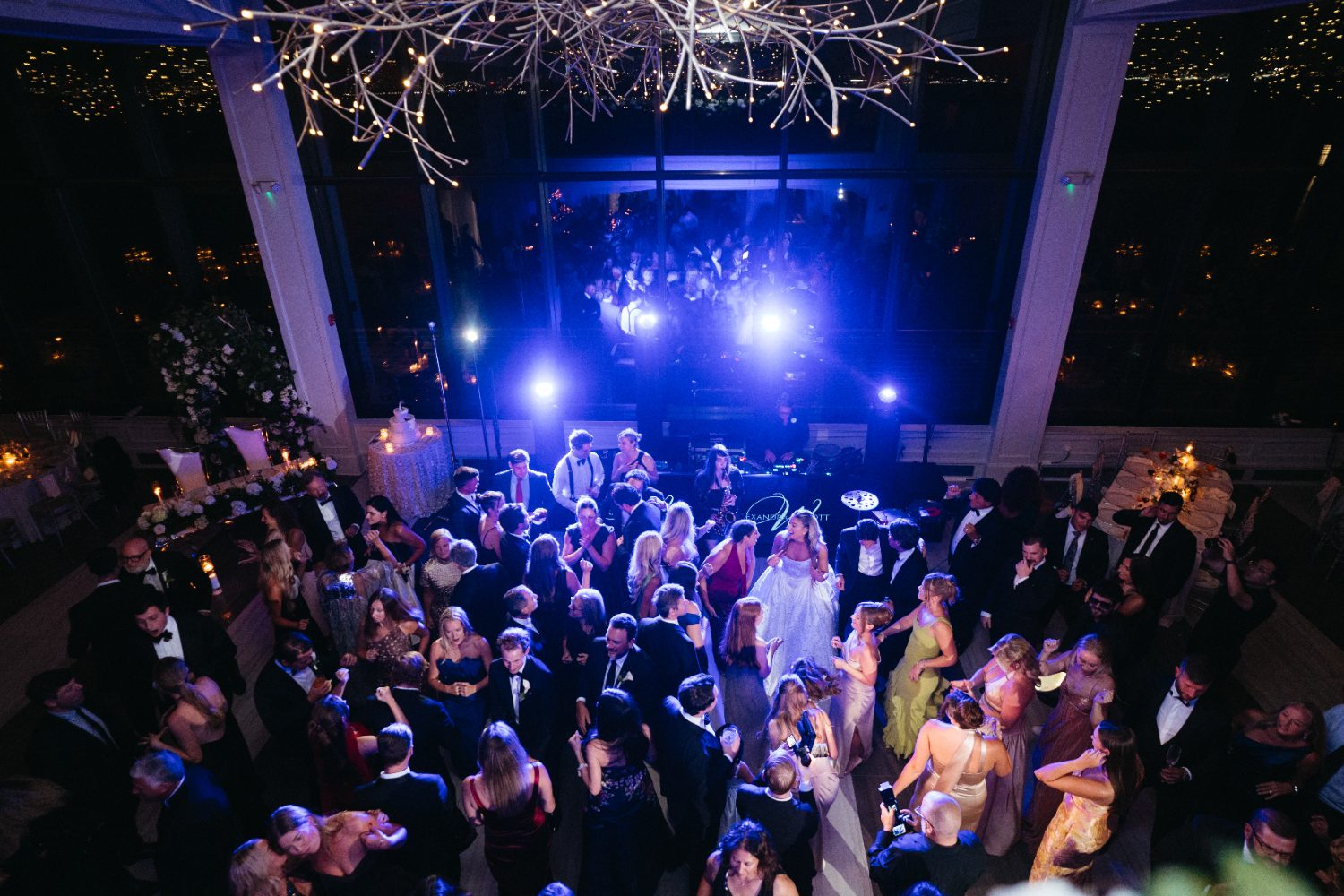 Reception floor lit blue with a city skyline behind